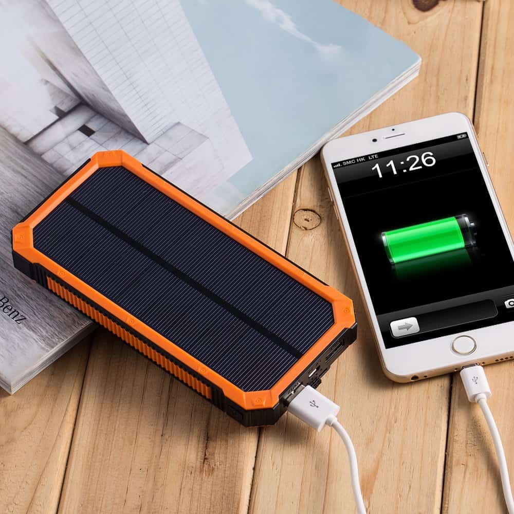 solar powered portable charger charging a phone