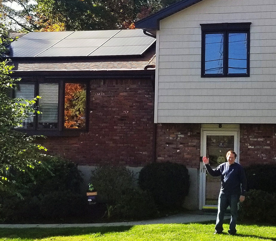 Larry Cohen in front of his solar home