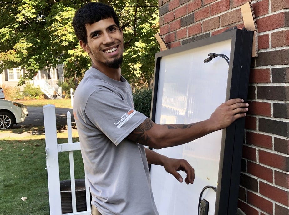 Solar Electrician climbing ladder